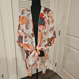 Colorful orange print kimono. Can be worn down or tied at waist. 100% light poly